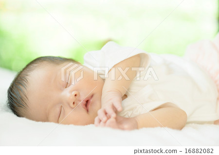 Baby sleeping at the window by the window 16882082