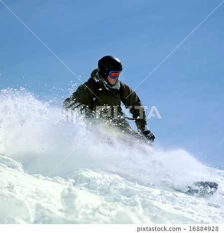 Snowboarder in deep powder 16884928