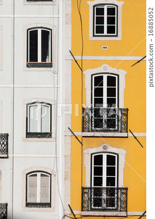 Row Houses with White and Yellow Facades 16885052