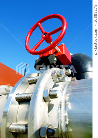 Industrial pipelines and valves against blue sky Industrial pipelines and valves against blue sky 16885178