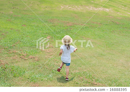 A girl walking on the meadow A girl walking on the meadow 16888395