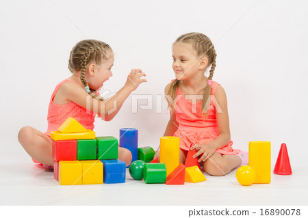 Girl frighten another girl playing with blocks Girl frighten another girl playing with blocks 16890078