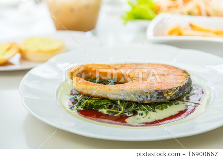 Grilled Salmon Steak with Spinach Grilled Salmon Steak with Spinach 16900667