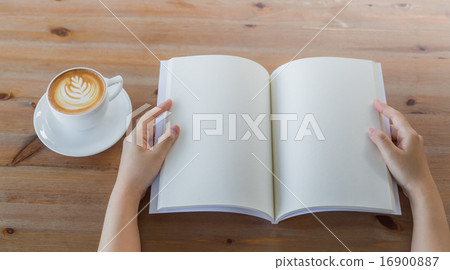 Hands open Blank catalog, magazines,book mock up on wood table w Hands open Blank catalog, magazines,book mock up on wood table w 16900887