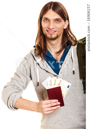 Man tourist backpacker holding money and passport. 16906257