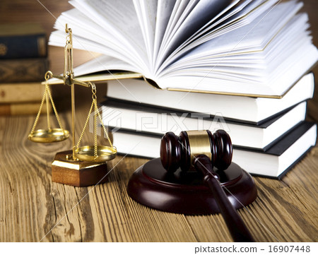 Wooden gavel and books, ambient light vivid theme Wooden gavel and books, ambient light vivid theme 16907448