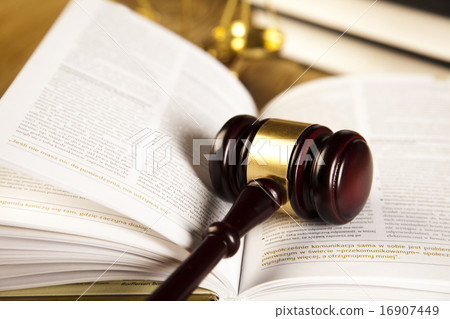 Wooden gavel and books, ambient light vivid theme Wooden gavel and books, ambient light vivid theme 16907449