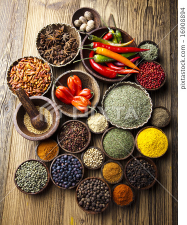 Assortment of spices in wooden bowl background 16908894