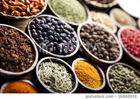 Assortment of spices in wooden bowl background 16908938