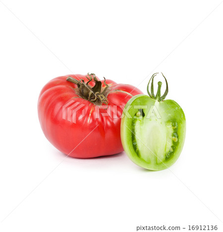 Red tomato and half of green tomato on white Red tomato and half of green tomato on white 16912136