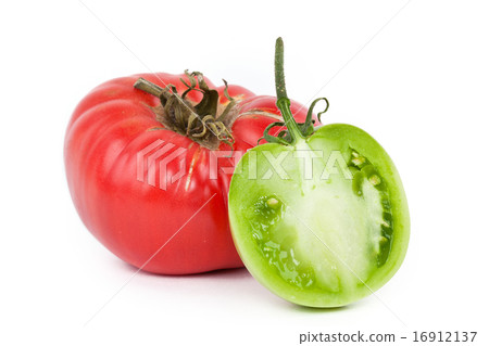 Red tomato and half of green tomato on white Red tomato and half of green tomato on white 16912137