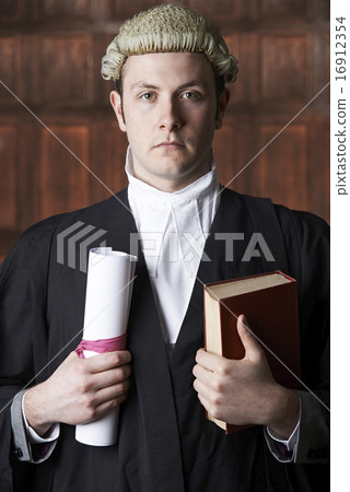Portrait Of Male Lawyer In Court Holding Brief And Book Portrait Of Male Lawyer In Court Holding Brief And Book 16912354