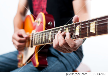 Unrecognizable guitarist playing guitar Unrecognizable guitarist playing guitar 16913702