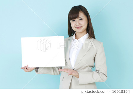 A smiling woman with a message board A smiling woman with a message board 16918394