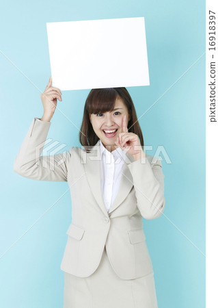 A smiling woman with a message board A smiling woman with a message board 16918397