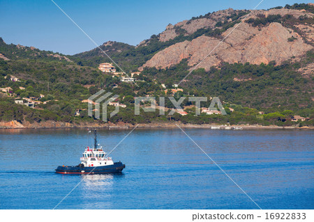 Small tug boat  underway on Porto-Vecchio bay 16922833