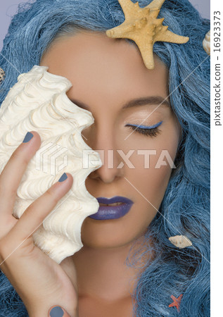 woman with blue hair, shells and closed eyes 16923373