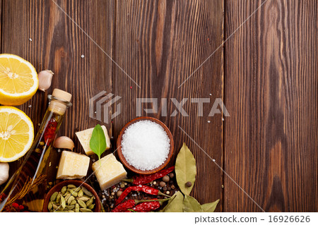 Various spices on wooden background 16926626