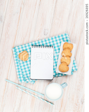 Cup of milk, heart shaped cookies and notepad Cup of milk, heart shaped cookies and notepad 16926895