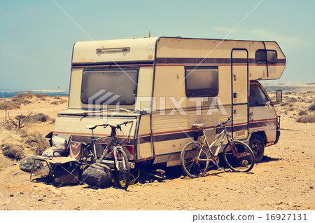 aged motorhome close to the sea, filtered aged motorhome close to the sea, filtered 16927131