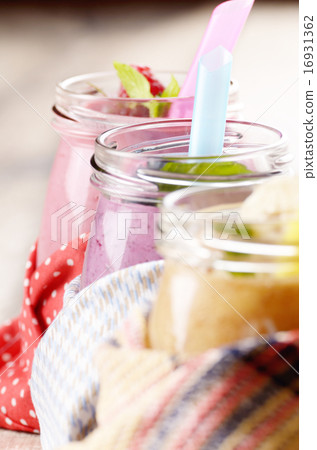 Assorted fruit shakes on white table 16931362