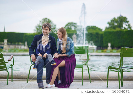 Happy family of three in Paris 16934071