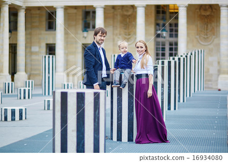 Happy family of three in Paris 16934080