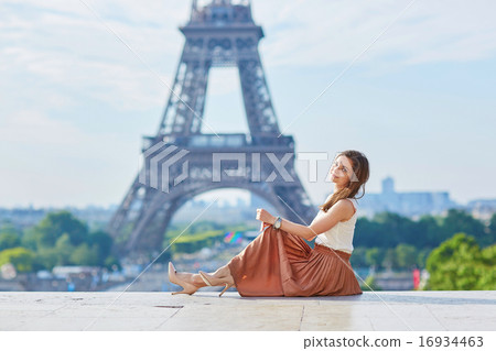 Beautiful young Parisian woman near the Eiffel tower 16934463
