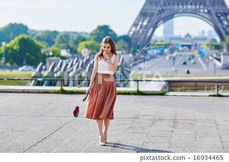 Beautiful young Parisian woman near the Eiffel tower 16934465