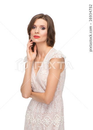 Caucasian woman touching her face and looking at the camera 16934782