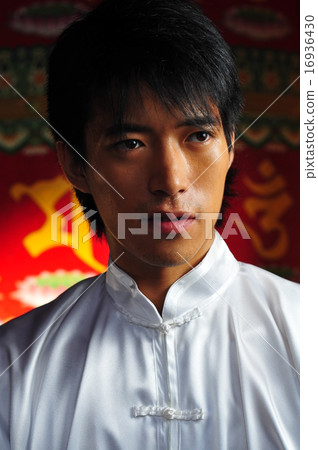 Close up of asian man in traditional clothing 16936430
