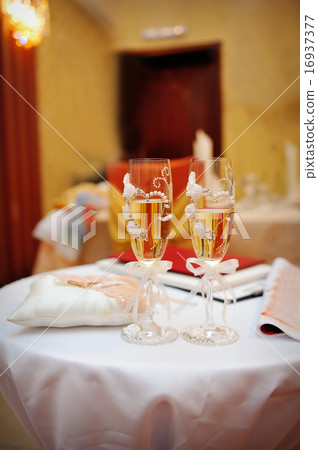 two glasses of champagne on the table two glasses of champagne on the table 16937377
