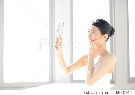 Female beauty watching mirror 16938746