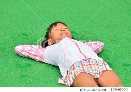 Girls taking a rest on the poolside 16940094