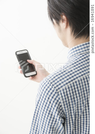 A man who operates a smartphone (hand) A man who operates a smartphone (hand) 16941891