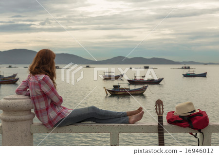 beautiful red-haired girl with a guitar beautiful red-haired girl with a guitar 16946012