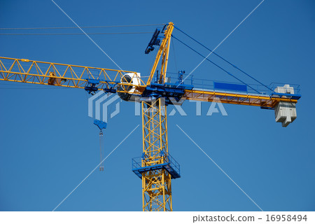 The construction crane against blue sky The construction crane against blue sky 16958494