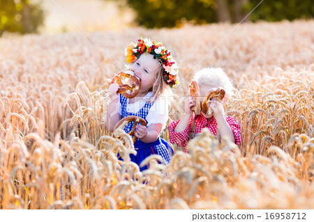 Kids in Bavarian costumes in wheat field 16958712