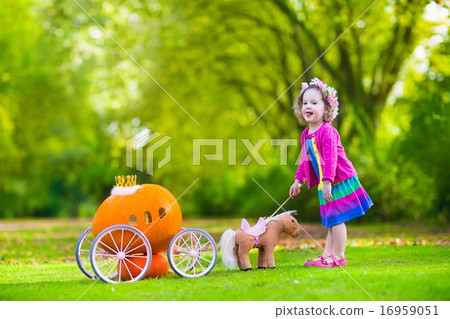Little girl at pumpkin patch at Halloween Little girl at pumpkin patch at Halloween 16959051