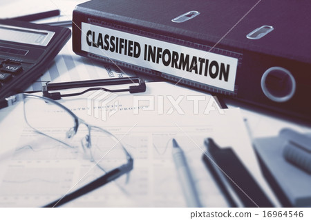 Classified Information on Ring Binder. Blured, Toned Image. Classified Information on Ring Binder. Blured, Toned Image. 16964546