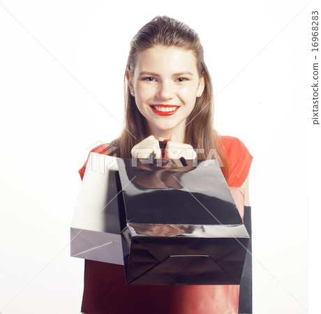 young pretty woman with bags on Christmas sale in red dress young pretty woman with bags on Christmas sale in red dress 16968283