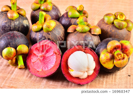 Fresh fruit in a basket on a wooden floor Fresh fruit in a basket on a wooden floor 16968347