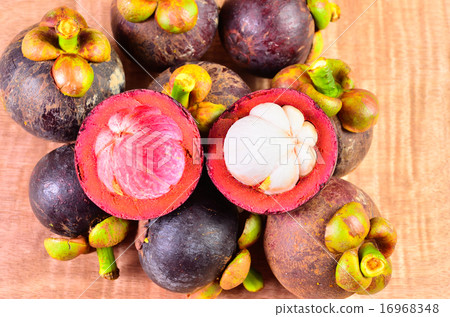 Fresh fruit in a basket on a wooden floor Fresh fruit in a basket on a wooden floor 16968348