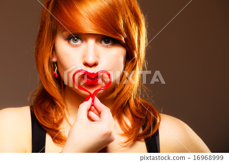 Woman creating heart symbol. 16968999