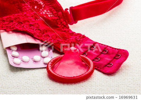 Pills and condom with lace lingerie. Pills and condom with lace lingerie. 16969631