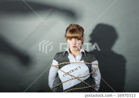 Upset businesswoman bound by contract terms. Upset businesswoman bound by contract terms. 16970313