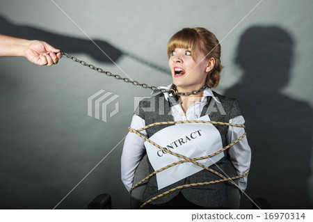 Upset businesswoman bound by contract terms. Upset businesswoman bound by contract terms. 16970314