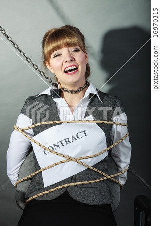 Upset businesswoman bound by contract terms. Upset businesswoman bound by contract terms. 16970315