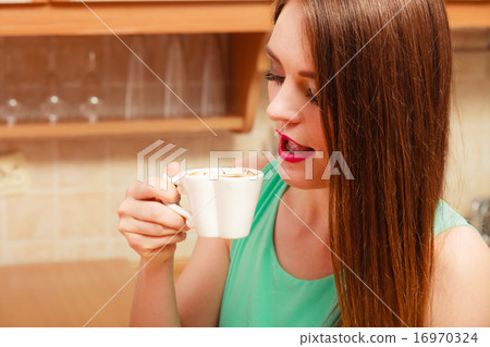 Woman drinking hot coffee beverage. Caffeine. Woman drinking hot coffee beverage. Caffeine. 16970324