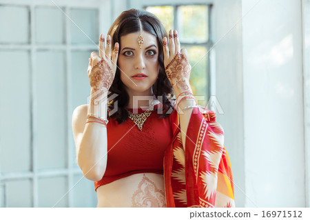 Indian picture on woman hands, mehendi tradition decoration Indian picture on woman hands, mehendi tradition decoration 16971512